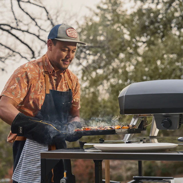 A Neapolitan pizza with leopard-spotted crust cooking on the stone inside the Koda 2 Pro